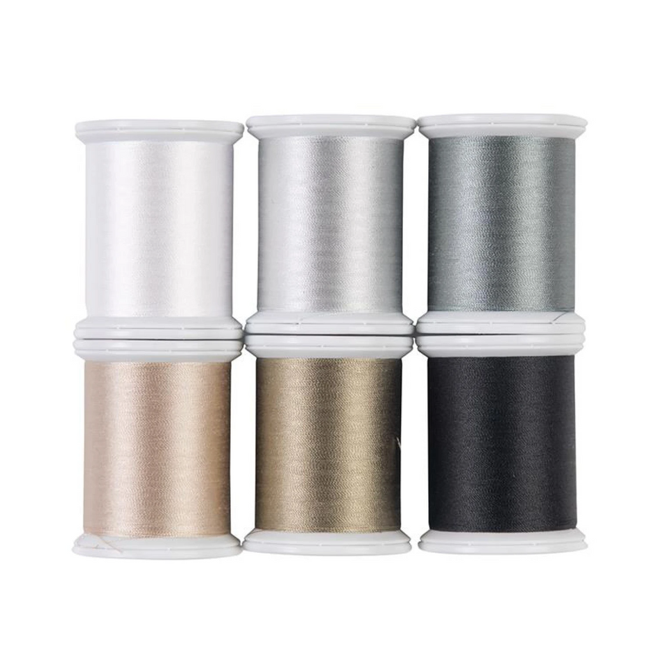 Six spools of thread arranged in a 2x3 grid on a white background, featuring white, silver, gray, champagne beige, gold, and black colors.
